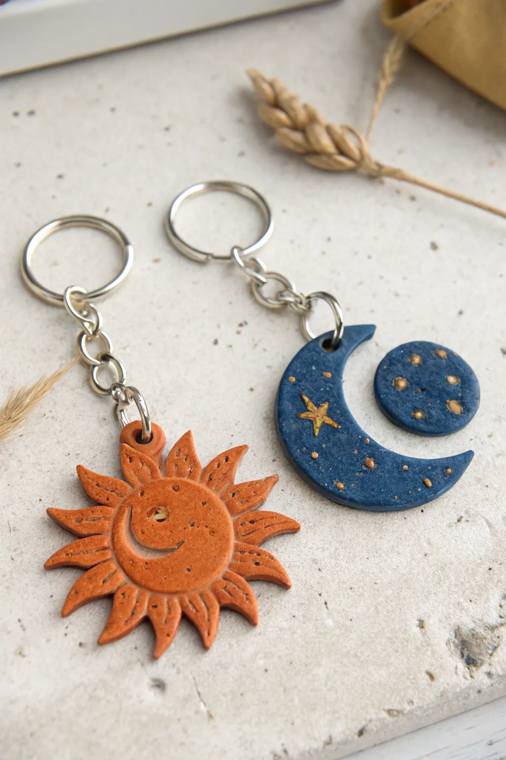 Matching sun and moon air clay keychain charms, a sweet craft date keepsake you can clip on.