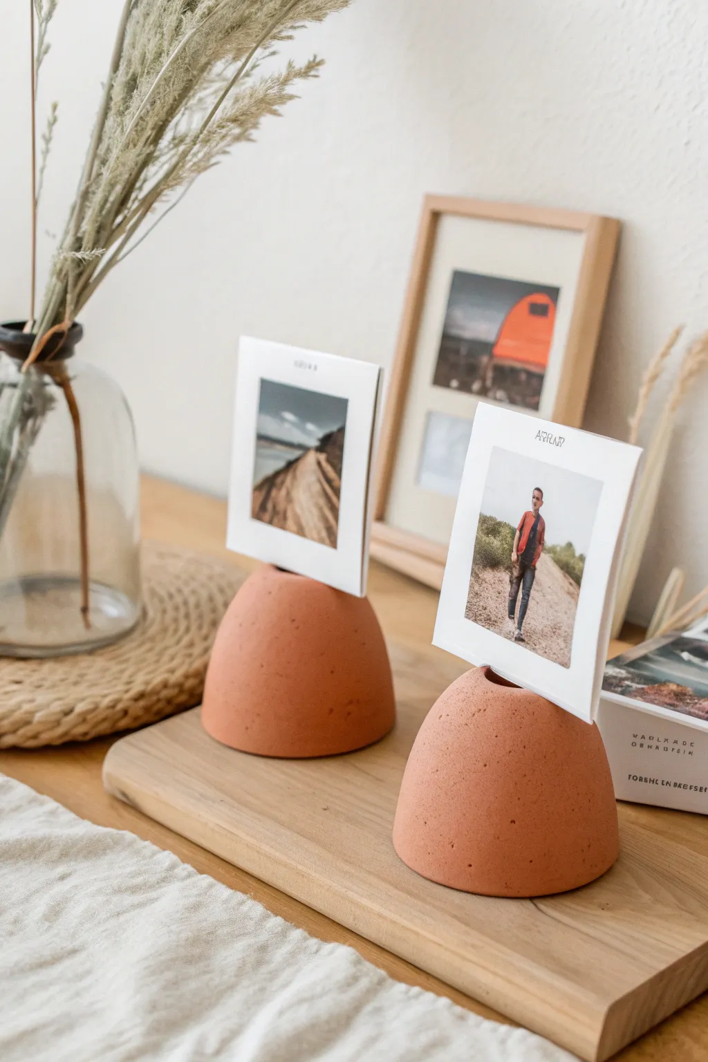 Minimal air-dry clay photo holders to display date-night memories, Scandinavian calm with bold color.