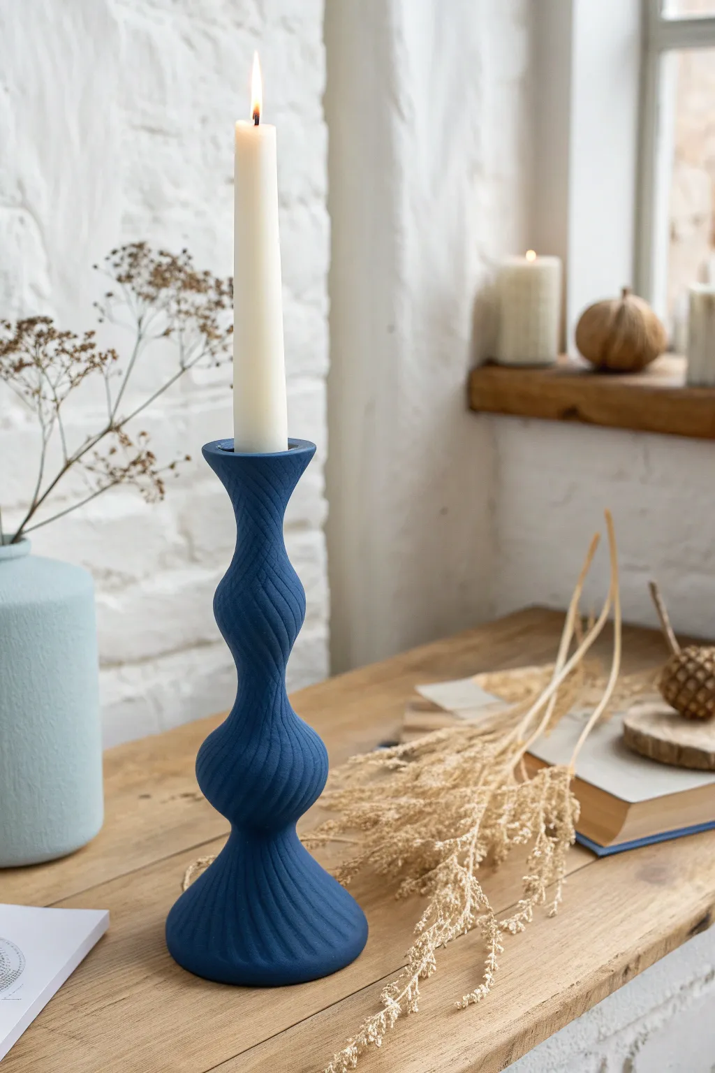 Sculptural wiggle taper holder made from air dry clay, styled minimal Scandinavian with boho stems.