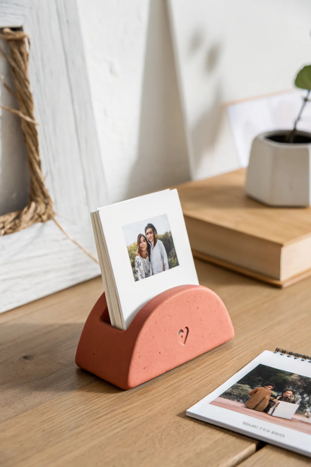 Air-dry clay desk photo holder with a tiny heart, a simple and sweet boyfriend gift idea