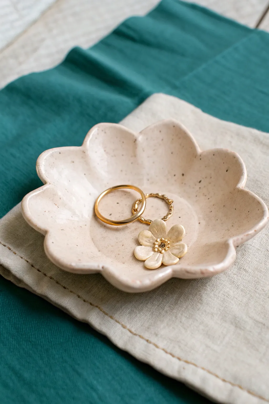 Scalloped pastel air-dry clay trinket dish with hoops, minimalist boho styling and bold contrast