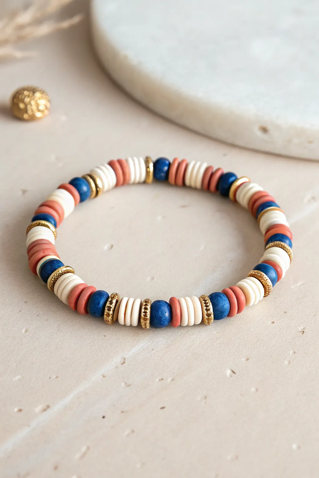 Thin stripe repeat clay bead bracelet in bold colors, minimalist flat lay with airy space