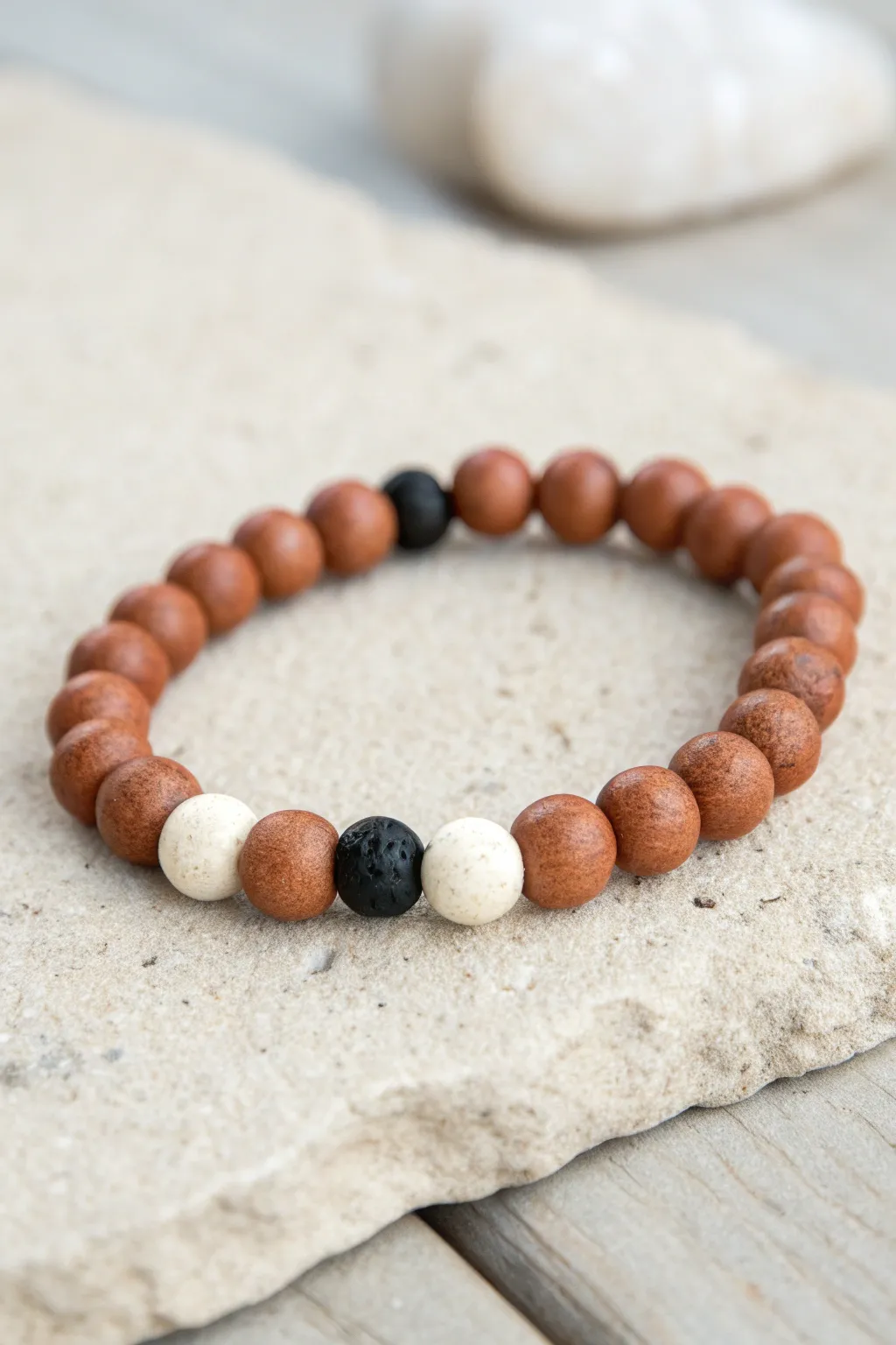 Neutral color-block clay bead bracelet in brown, cream, and matte black for minimalist boho style.