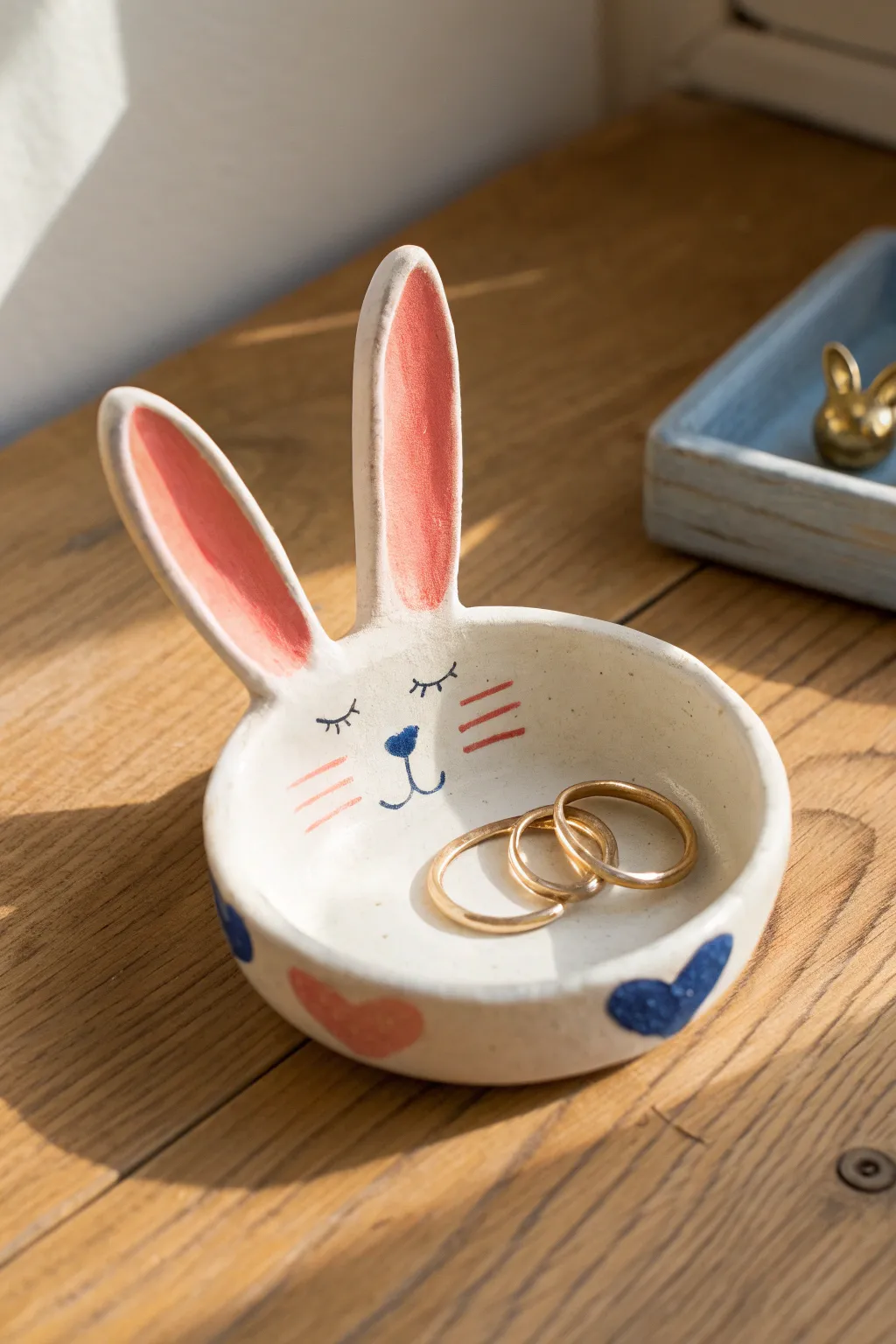 Sweet bunny face ring dish with upright ears, a cozy clay idea to keep your rings in one place.