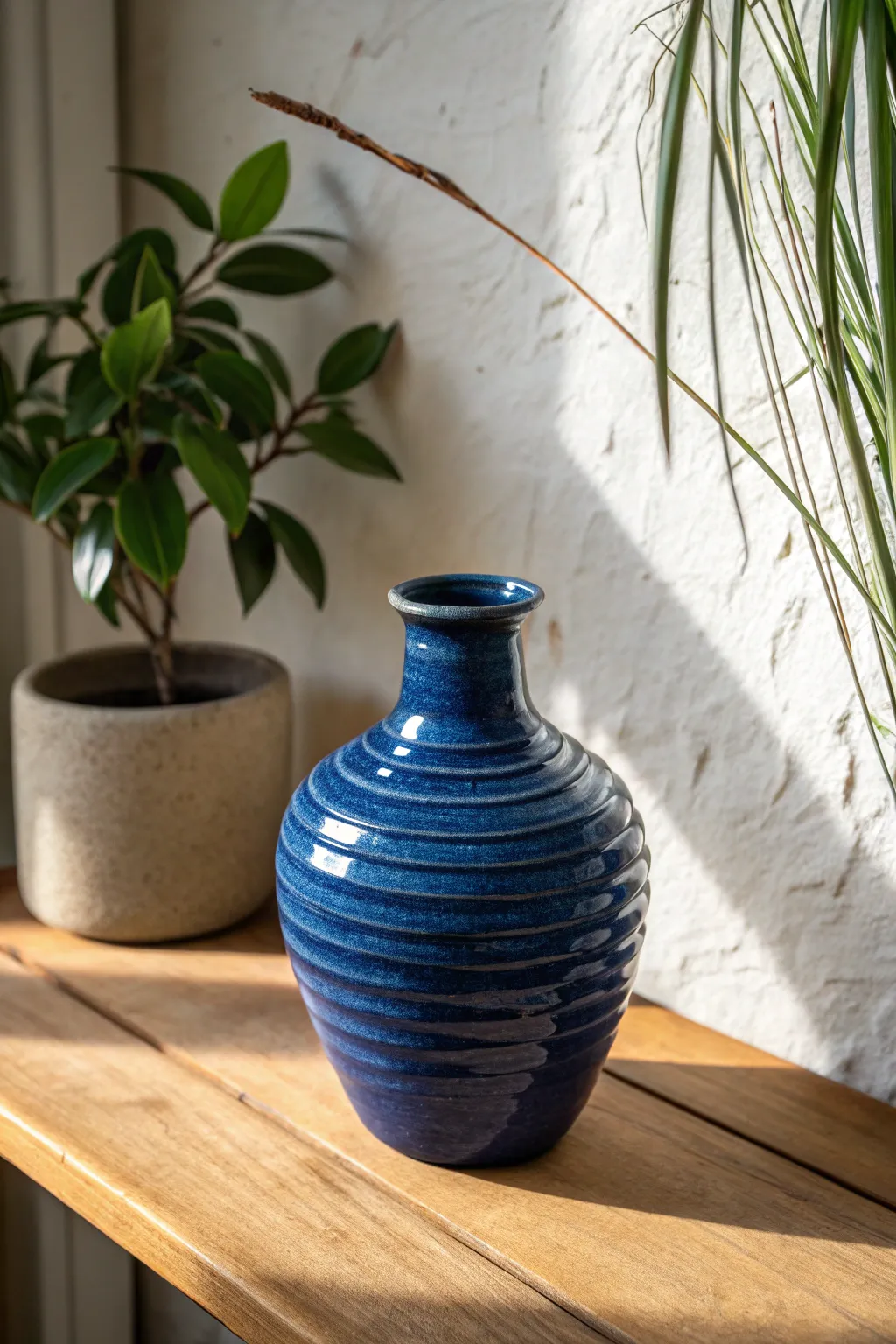 Easy coil vase with visible hand-built lines in bold glaze, minimalist Scandinavian styling.