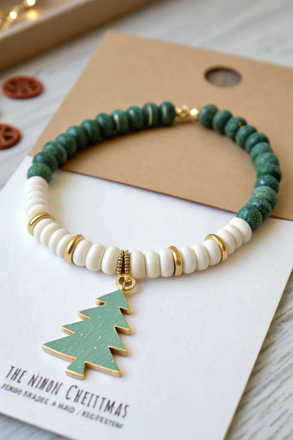 Minimal Christmas clay bracelet with a tree charm centerpiece, ready to gift and easy to make.