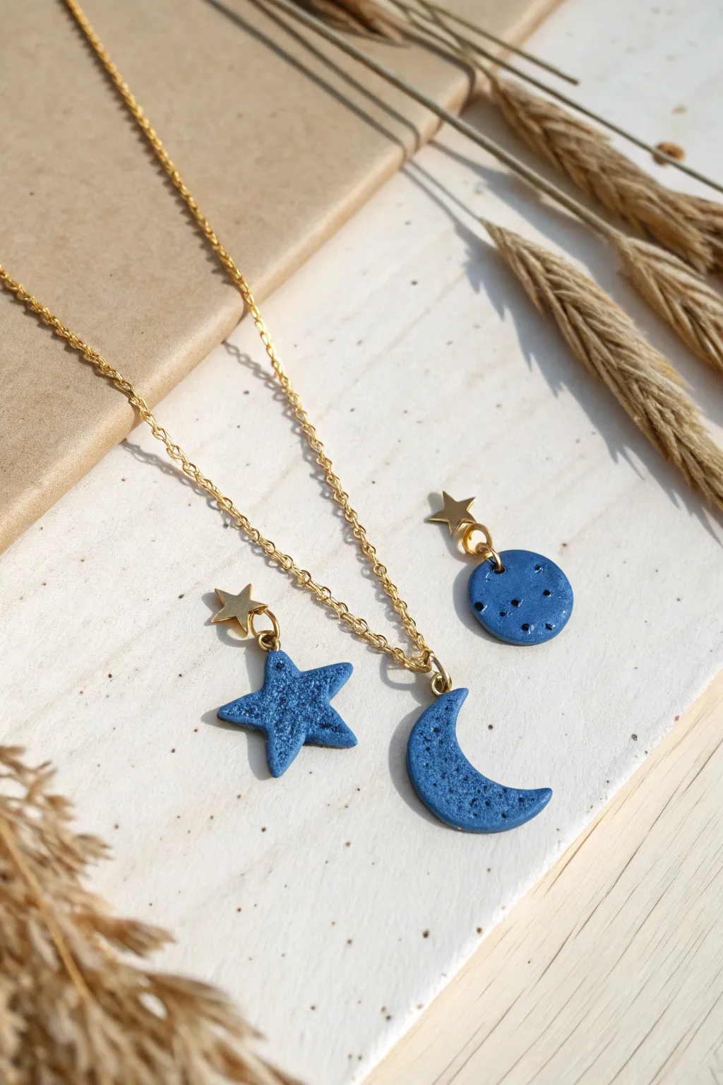 Tiny matte clay charm pendants in bold cobalt, perfect for effortless minimalist layering.