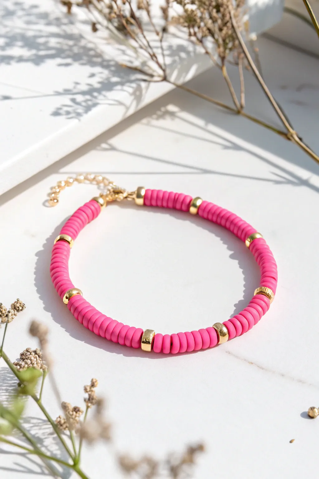 Monochrome hot pink heishi bracelet with tiny spacers for an easy bold, minimalist pop.