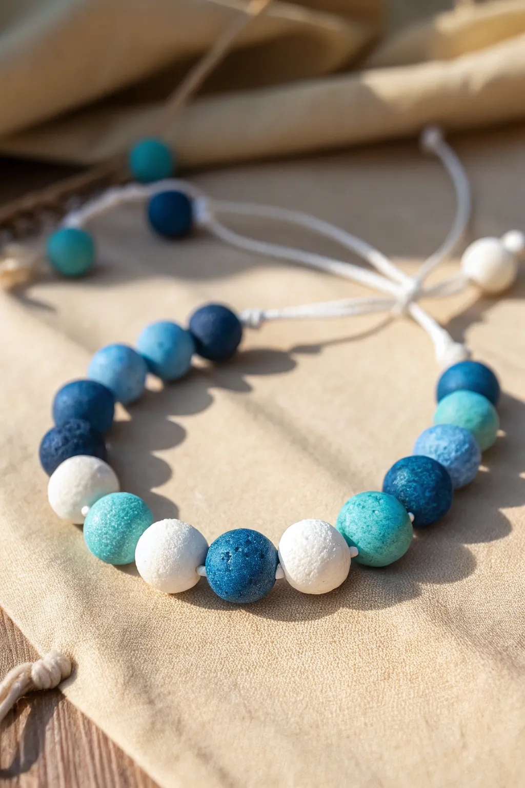 Ocean Blues and Seafoam: a simple clay bead bracelet gradient for an effortless coastal vibe.