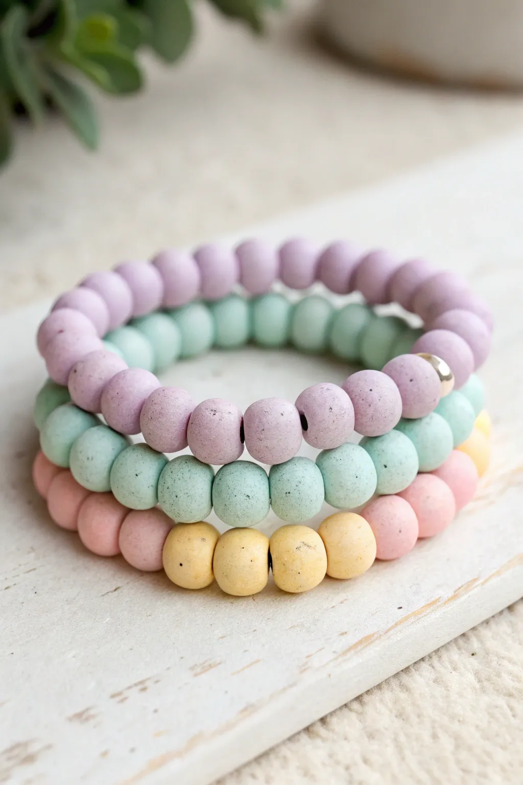 Pastel clay bead bracelet stack in mint, lavender, blush, and butter yellow for sweet selling ideas