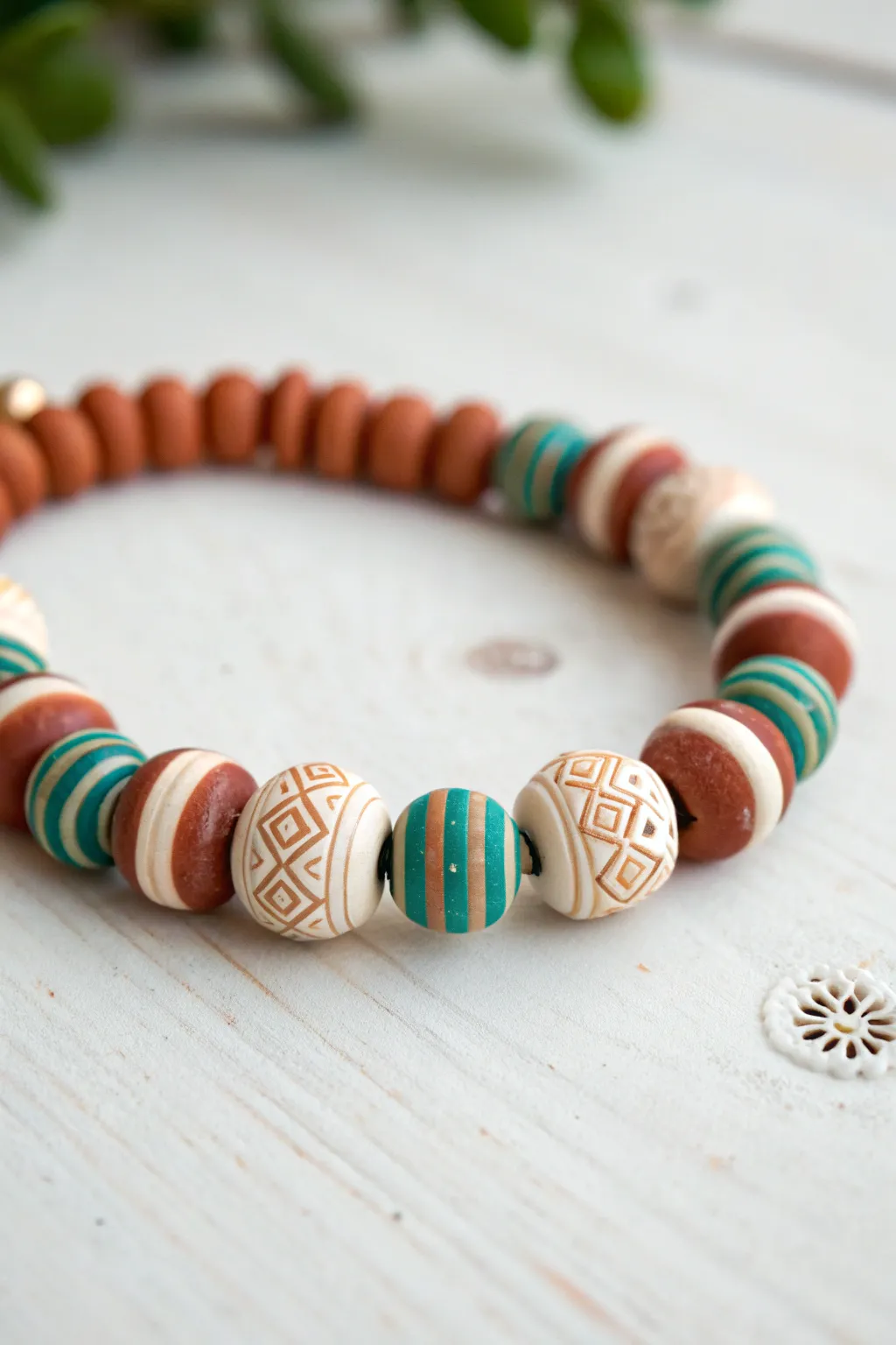 Crisp striped polymer clay bracelet with repeating color bands, minimalist Scandinavian style with boho warmth