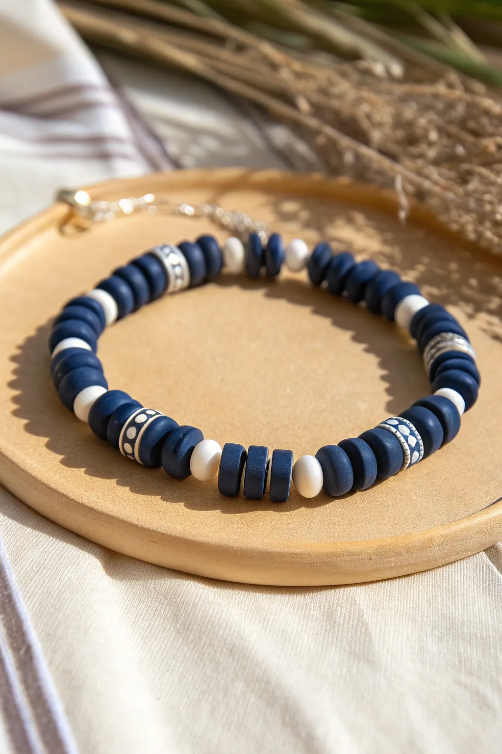 Navy and white striped clay bead bracelet for a crisp nautical look with minimalist boho charm.
