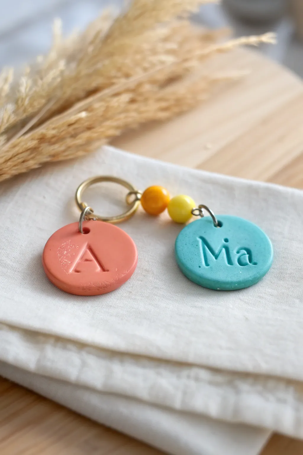 Bright clay name and initial keychain set, a simple handmade birthday gift with bold color pop