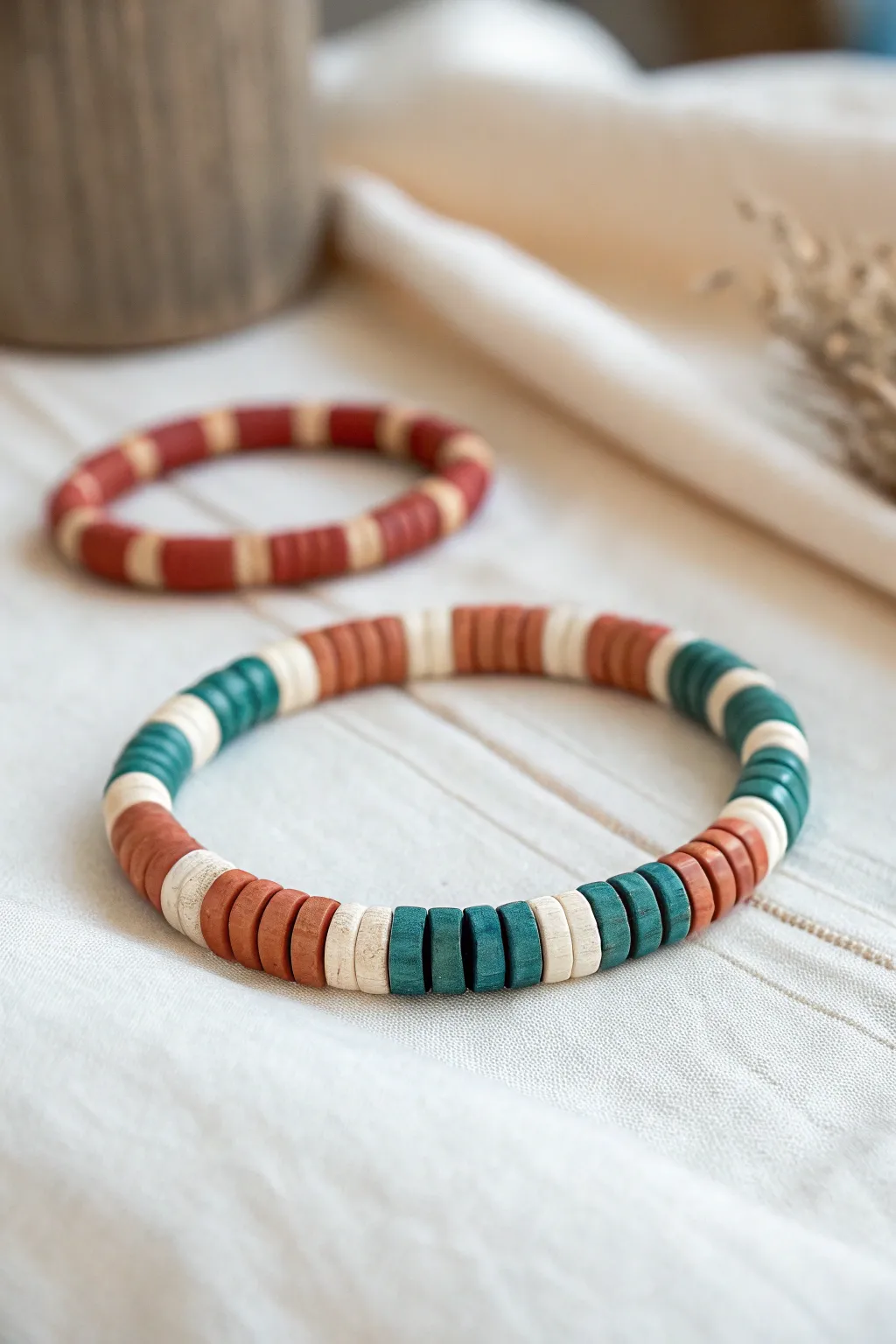 Chunky color block clay heishi bracelet with matching striped set for easy DIY style.
