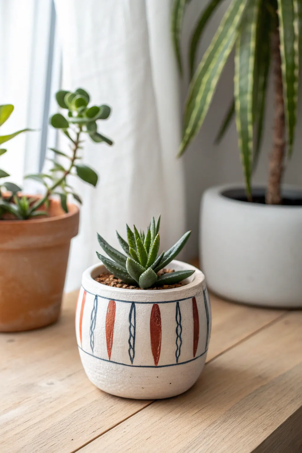 Easy mini pinch pot planter with bold stripes and a tiny succulent for quick, cute clay decor.