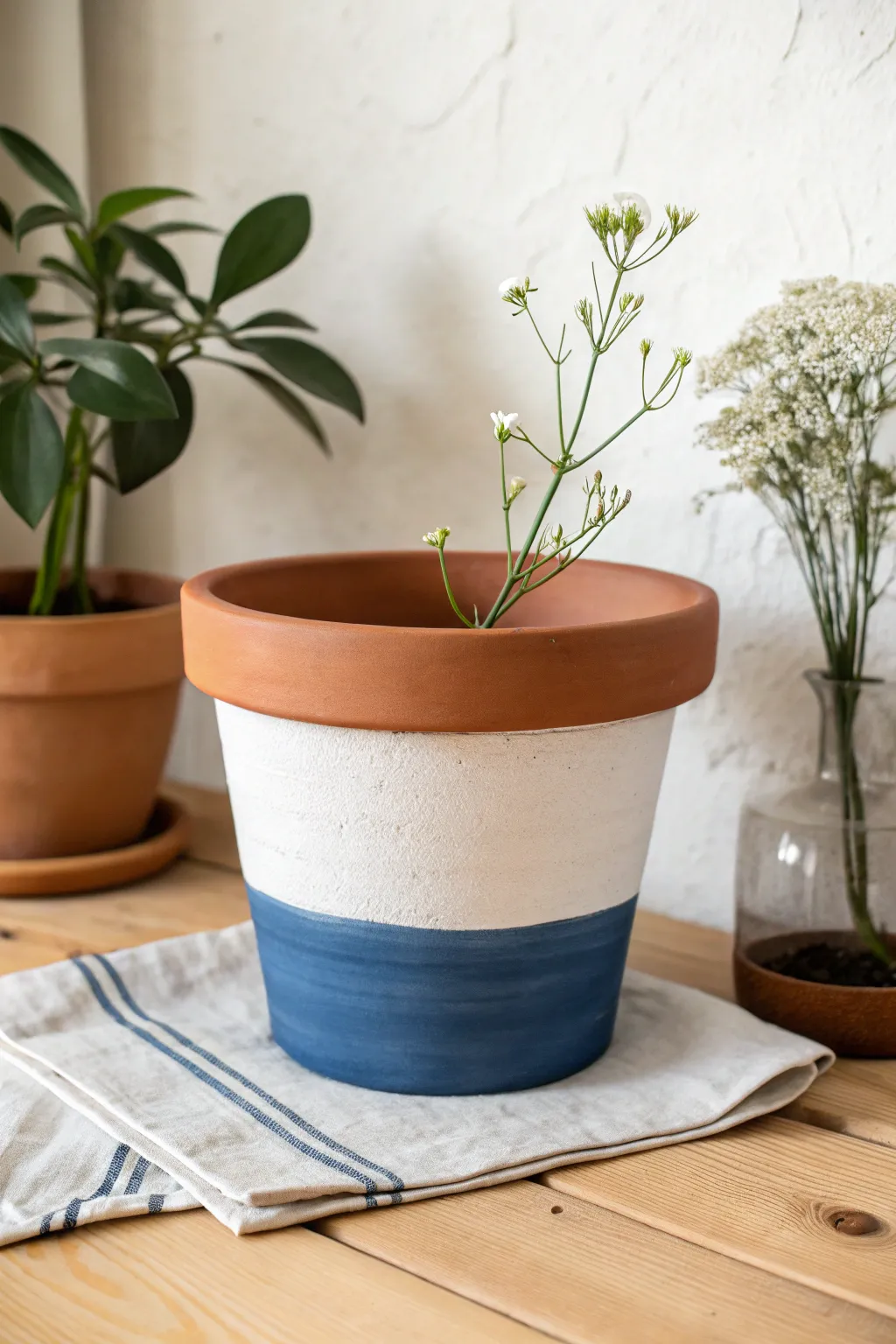 Two-tone dipped terracotta planter with bold color contrast and a clean Scandinavian finish.