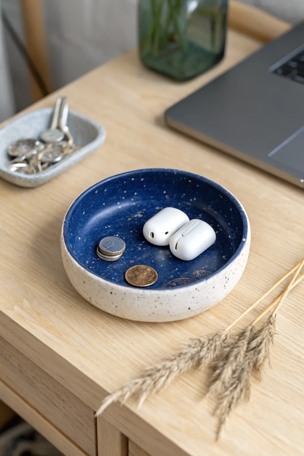 A bold midnight-blue catch-all dish that keeps coins and earbuds tidy on any desk.