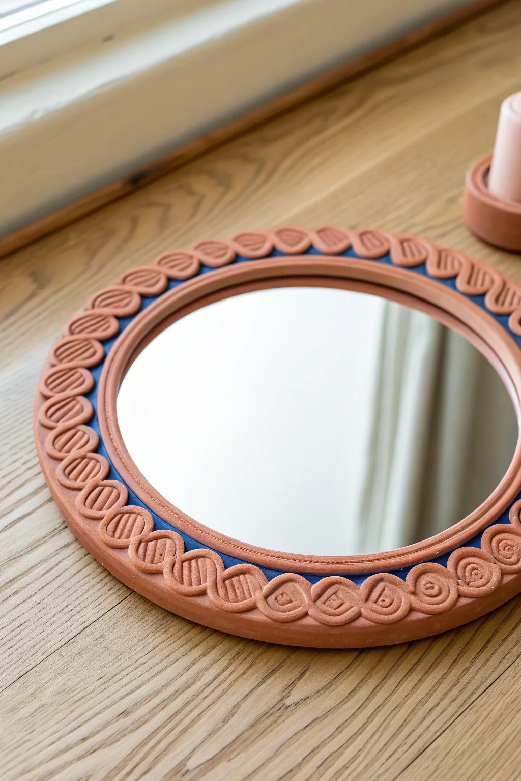 Bright squiggle clay frame turns a simple mirror into a playful minimalist statement piece.