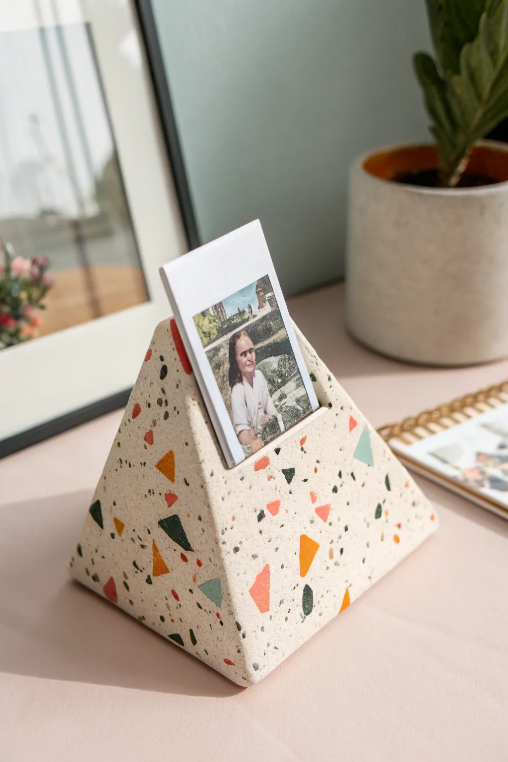 Terrazzo speckled clay wedge stand that holds a photo beautifully with a clean, minimalist vibe