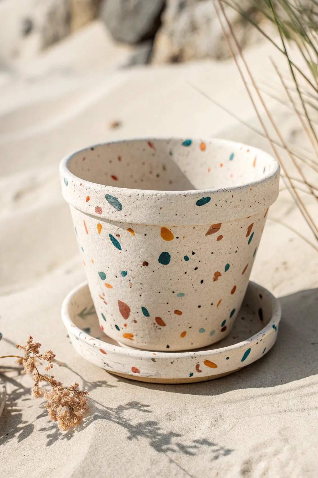 Terrazzo speckle terracotta pot in bold flecks on an ivory base, easy DIY and chic.