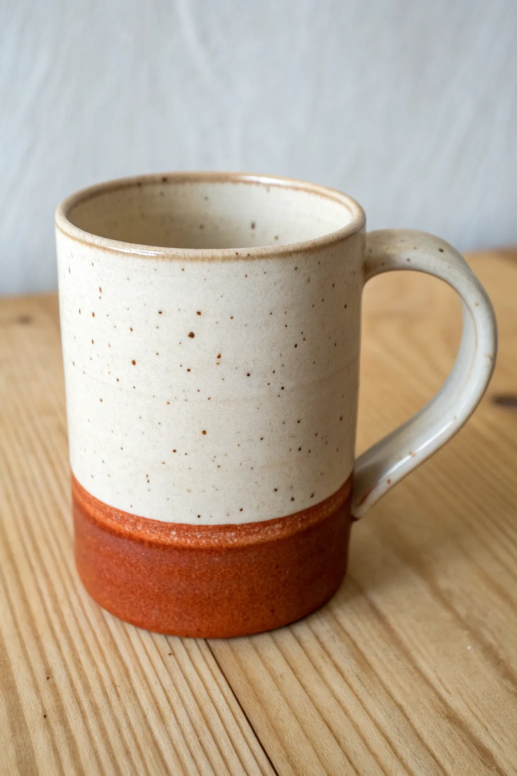 Straight-sided slab mug with a clean seam and bold dip-glaze contrast, minimal and handmade.