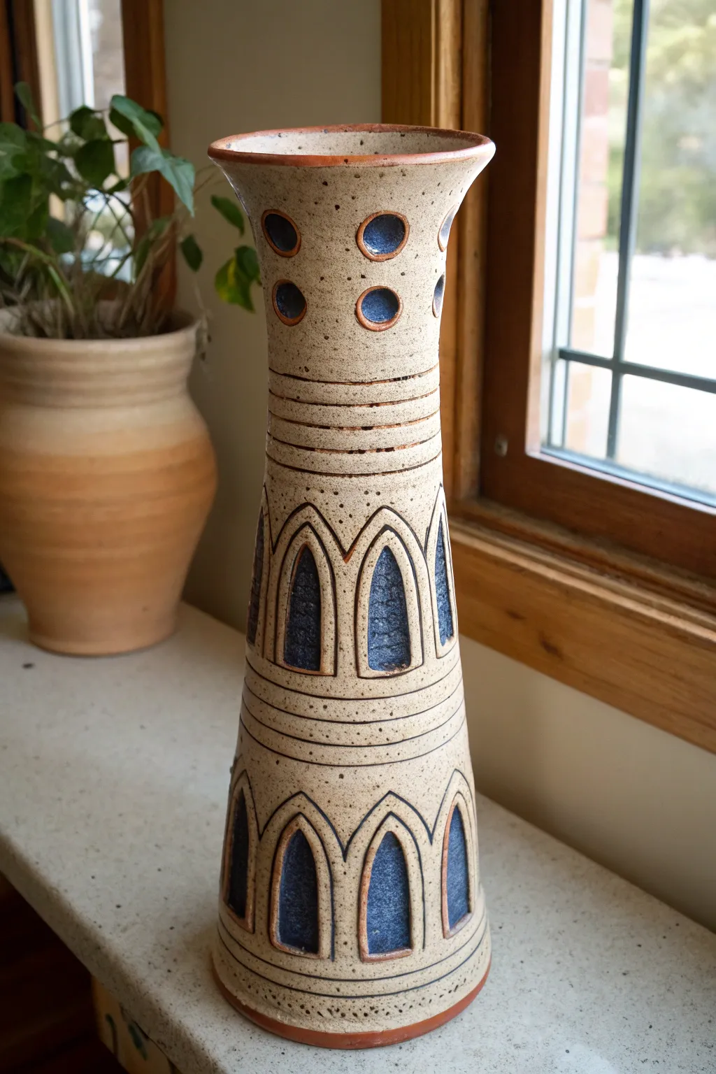 Coil-built tower vase with bold arches and clean minimal lines, simple to make and striking