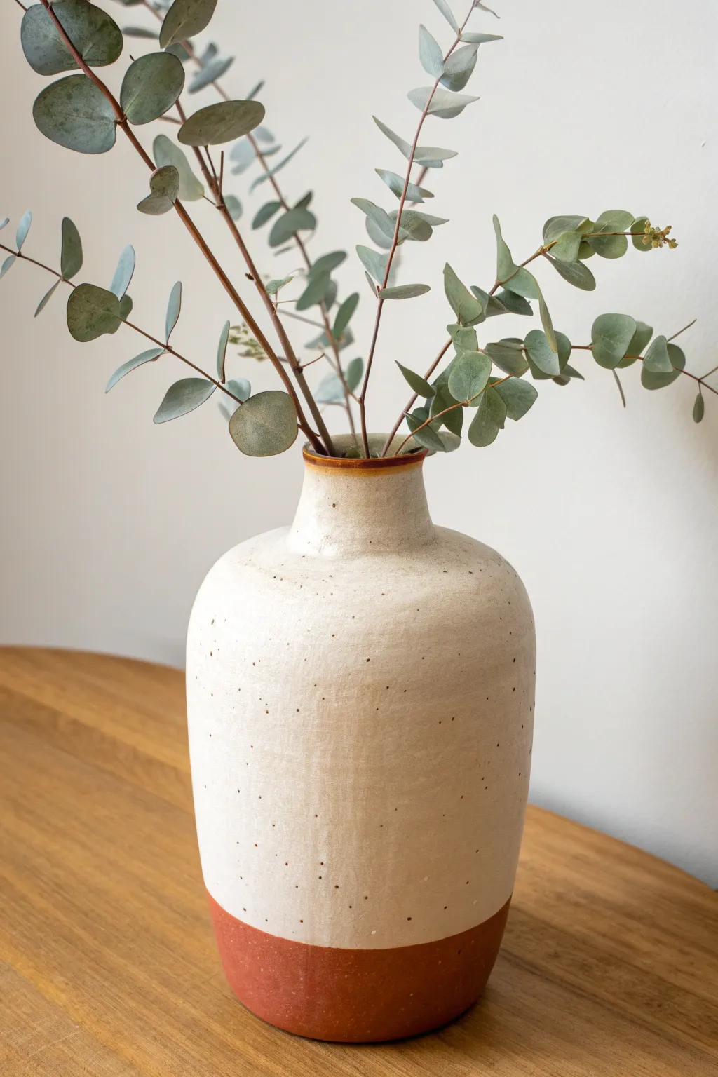 Two-tone color block clay vase in creamy white and terracotta for a bold minimalist look
