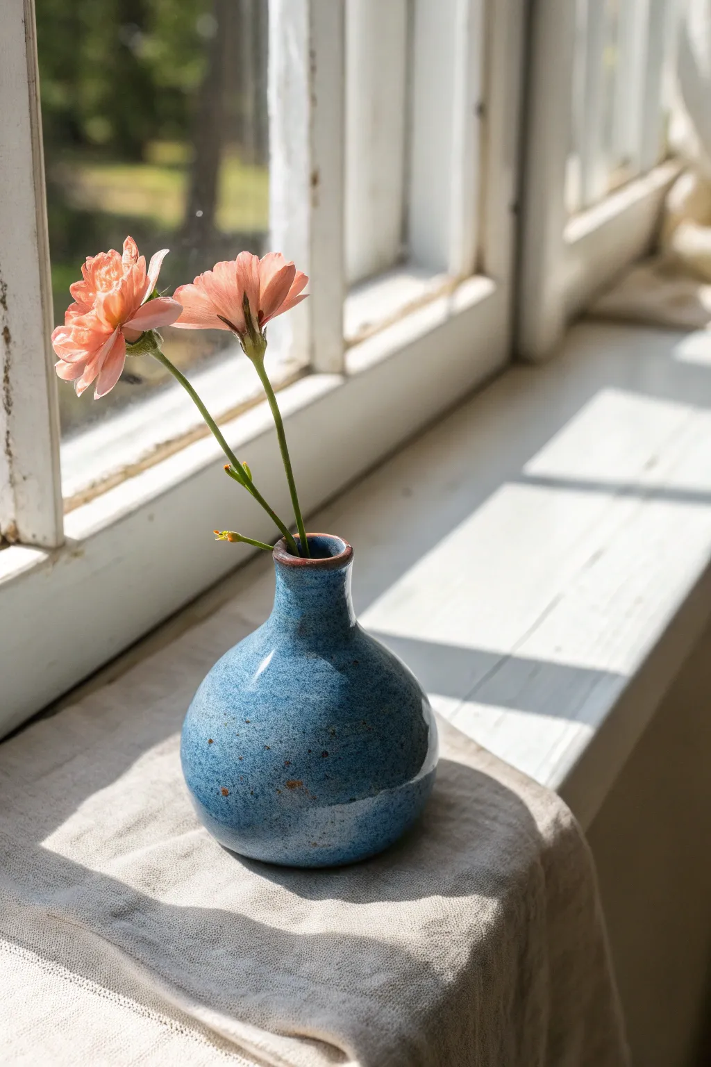 Easy pinch pot bud vase with a single bloom, bold glaze on a sunny minimalist windowsill.