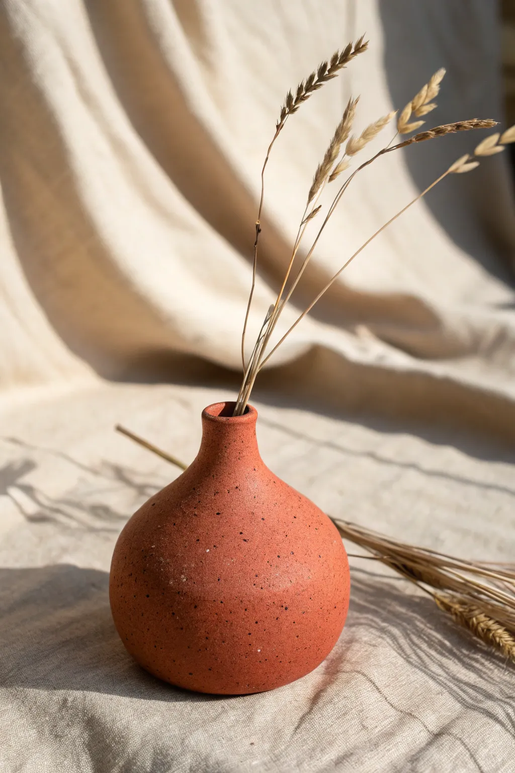 Simple wheel-thrown bud vase with a tiny neck, bold color, and calm Scandinavian warmth