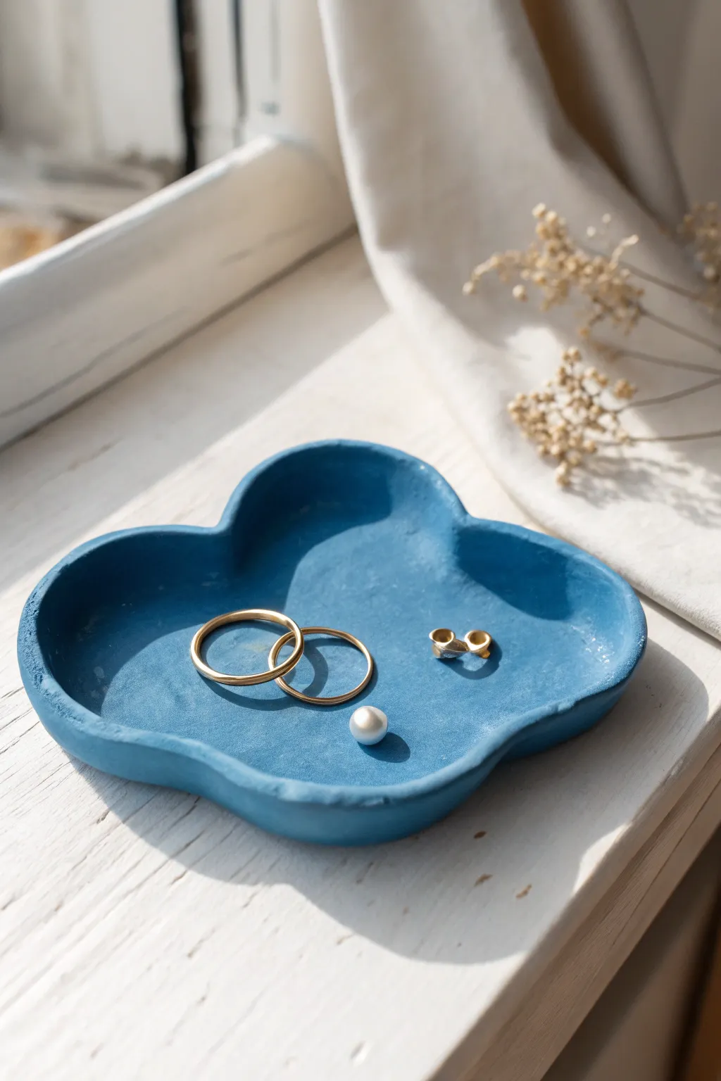 Sweet cloud trinket dish in bold glaze, a minimalist spot for rings and tiny treasures.
