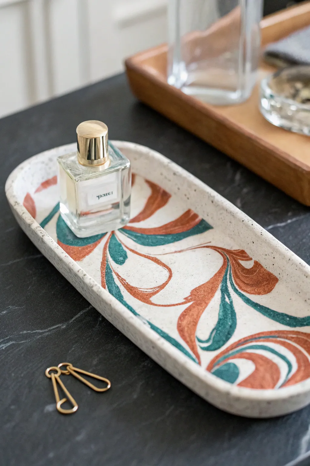 Marbled clay vanity tray in bold earthy tones, a chic minimalist accent for your daily ritual.