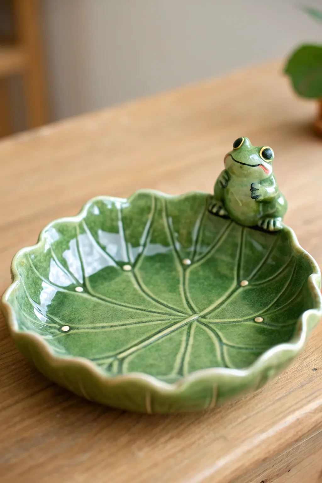 Lily pad ring dish with a smiling frog, cozy cottage garden styling in bold, glossy green