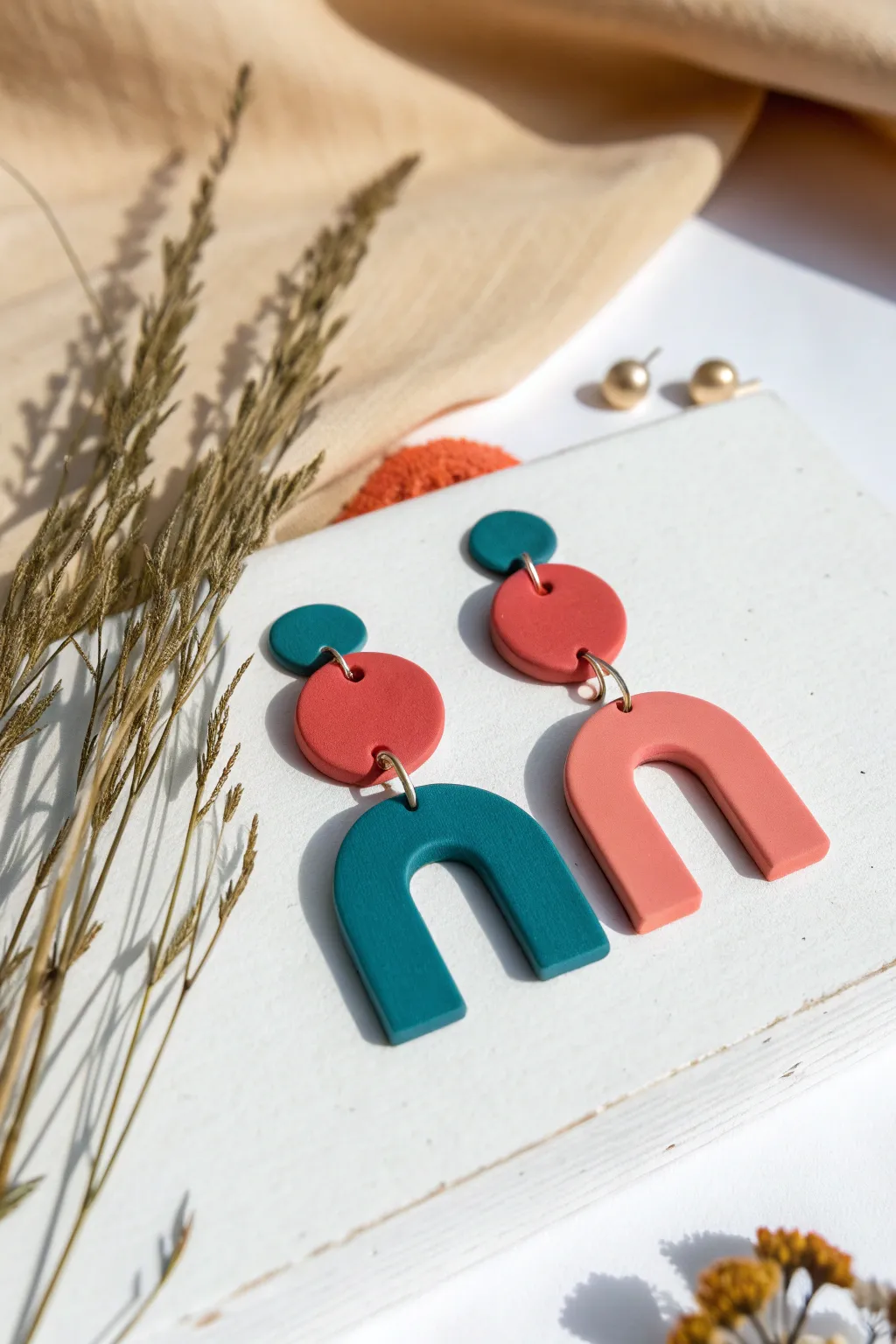Simple matte polymer clay earrings in bold shapes, Scandinavian minimal with a boho pop.