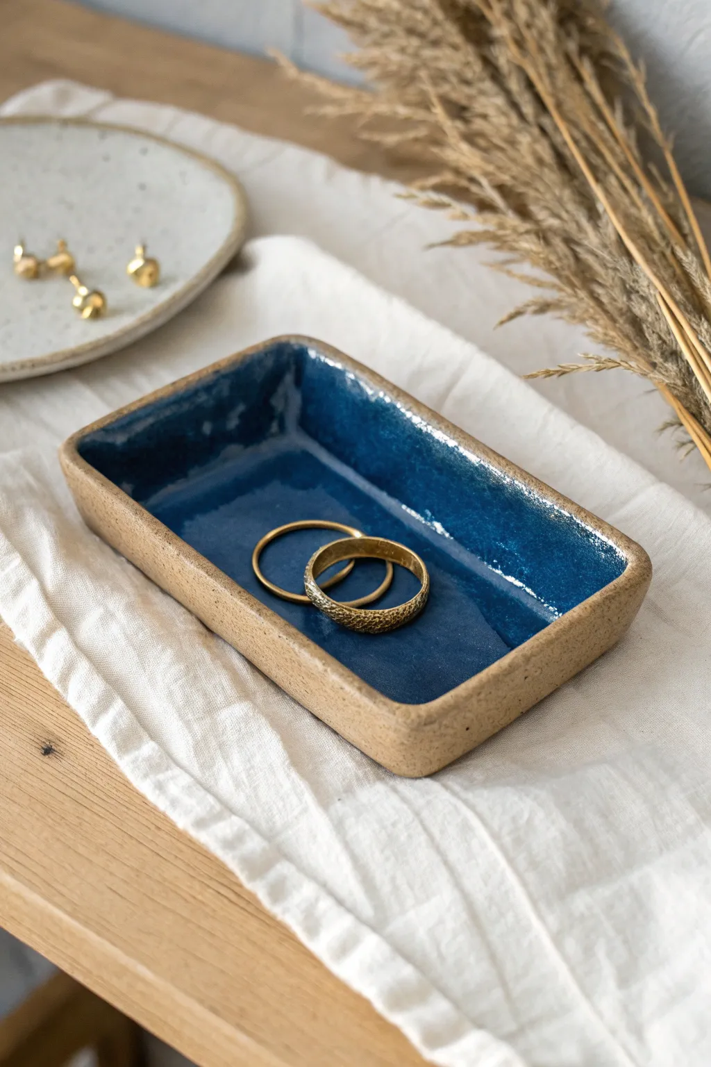 Simple slab-built catchall tray with lifted corners, bold glaze, for rings and hair clips