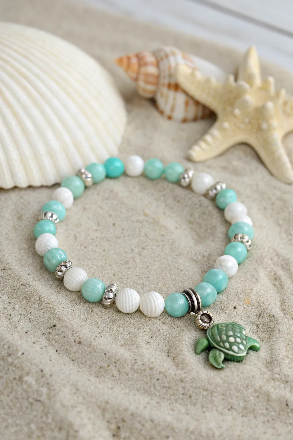 Aqua and white clay bead bracelet with a sweet sea turtle charm for an easy beachy vibe