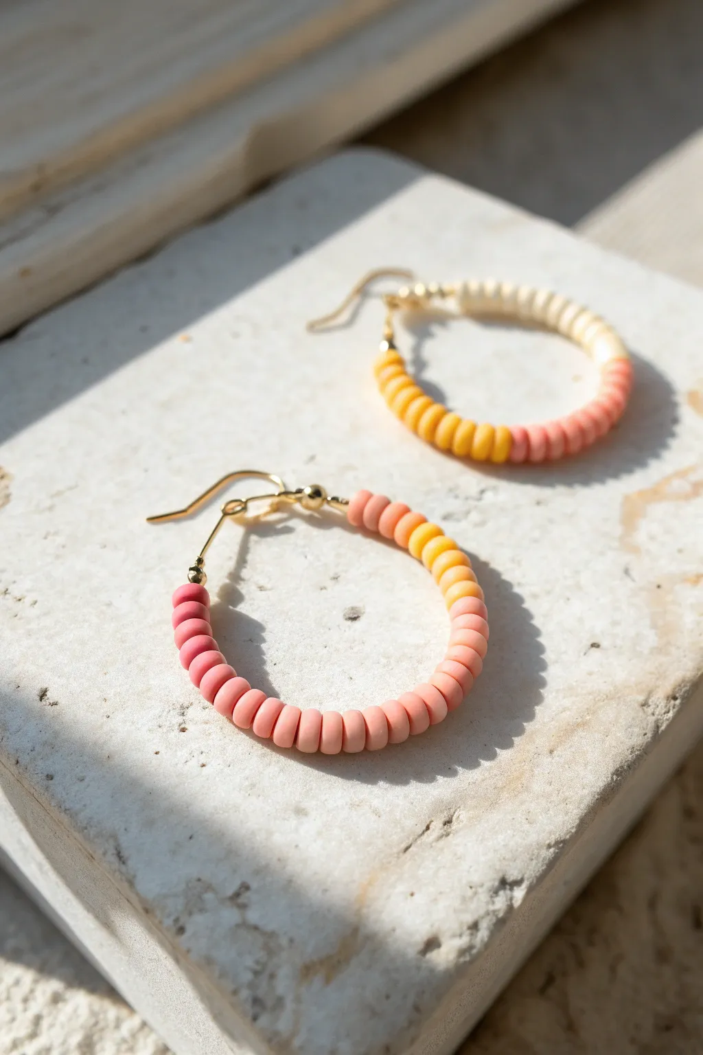 Sweet ombré hoop earring in pink-to-sunshine gradient, minimalist styling, handmade charm.