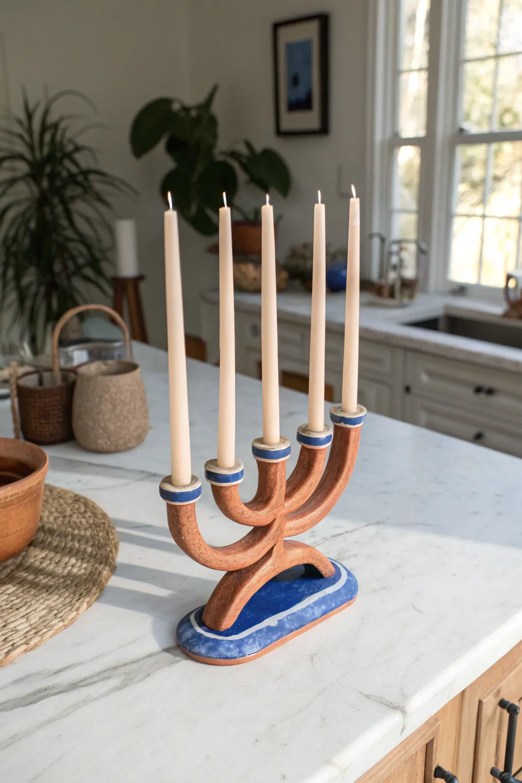 Wavy clay candelabra with bold color contrast, minimalist curves, and cozy taper candle glow