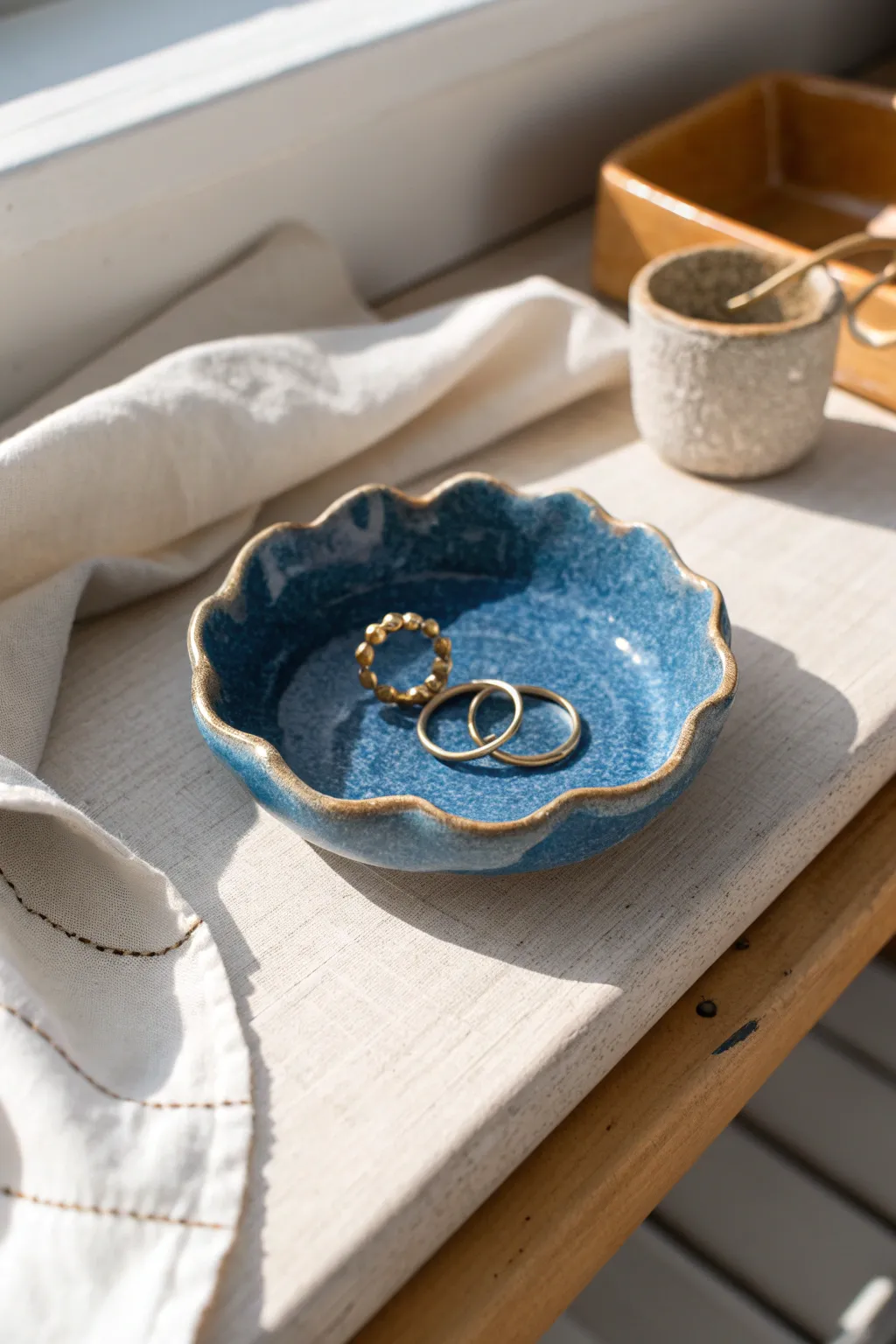 Easy ceramic ring dish with a softly wavy rim, perfect for keeping rings and earrings tidy.