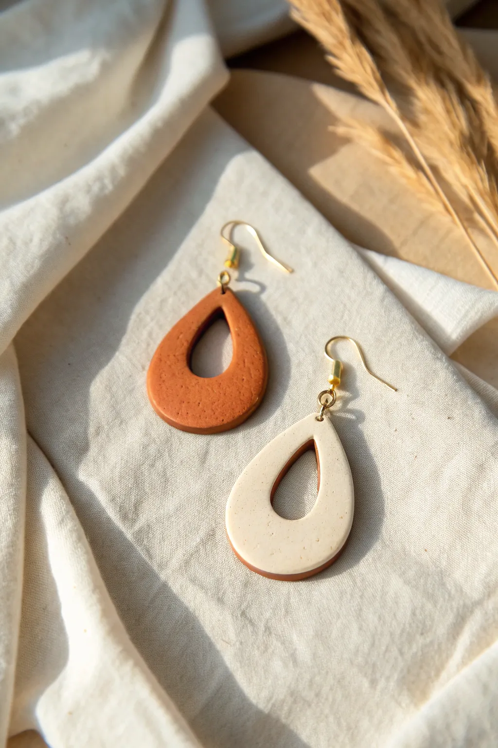 Minimal teardrop dangle earring in bold two tone clay with cutout, perfect DIY inspo.