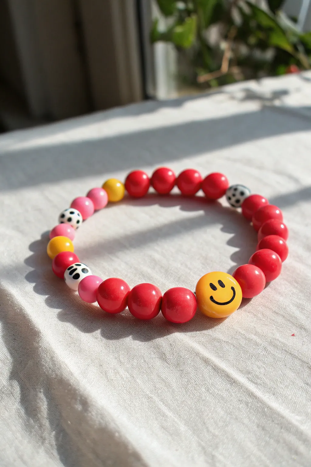 Bright polymer clay smiley bead bracelet, a cheerful kid-friendly project with bold Scandinavian style