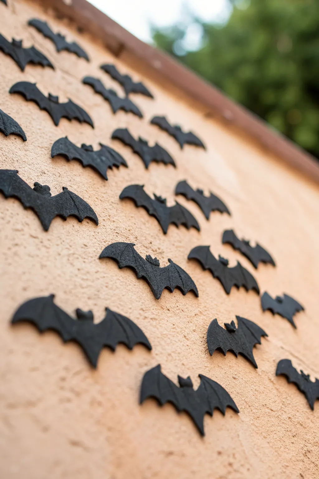 Matte-black clay bat wall dots for a chic minimalist Halloween accent with bold contrast.