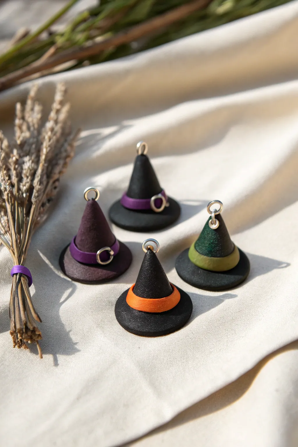 Minimalist black witch hat polymer clay charms with colorful bands and jump rings, ready to use