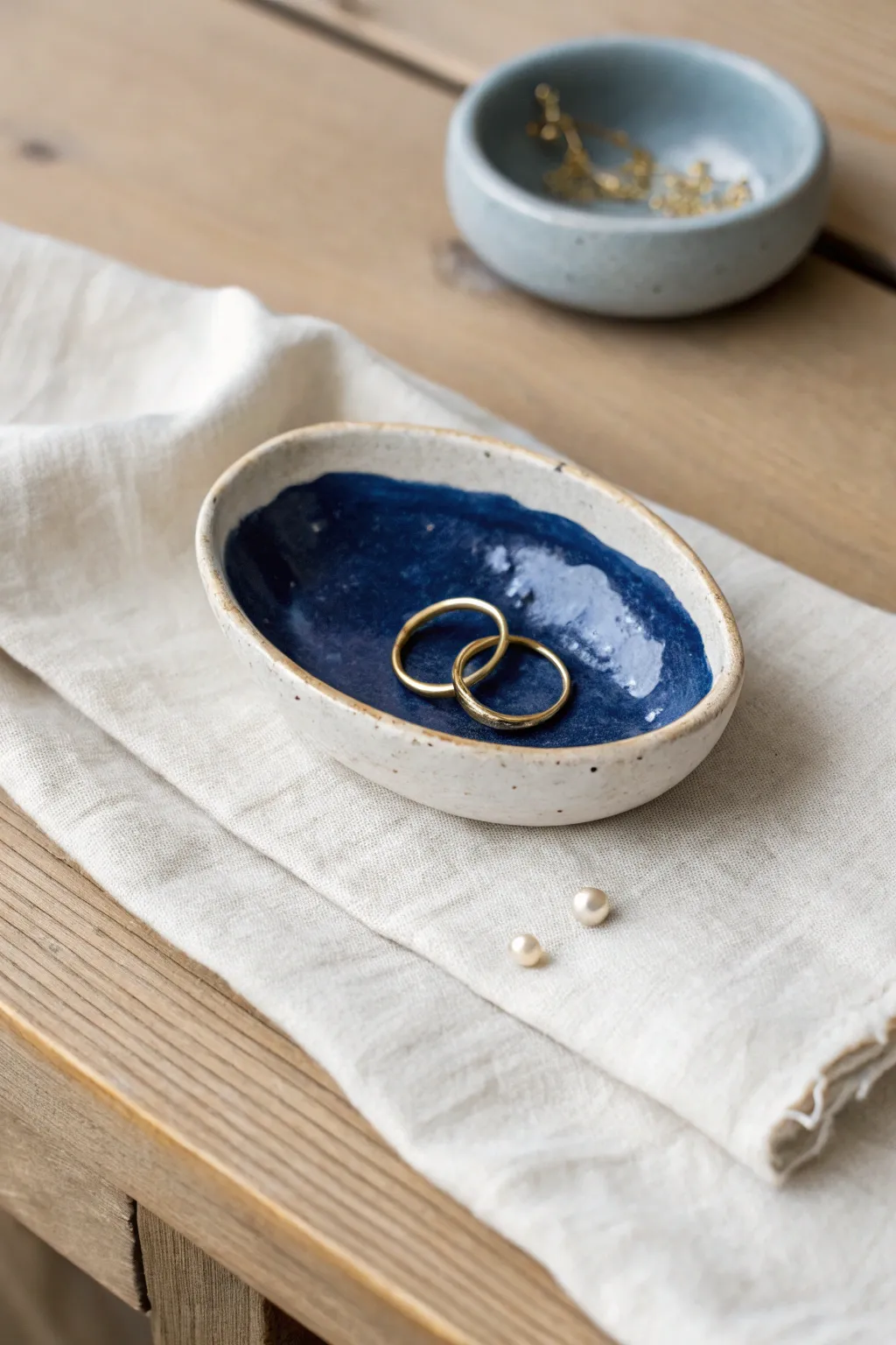 Organic thumb-pressed trinket dish to hold rings and earrings, minimalist style with a bold color pop