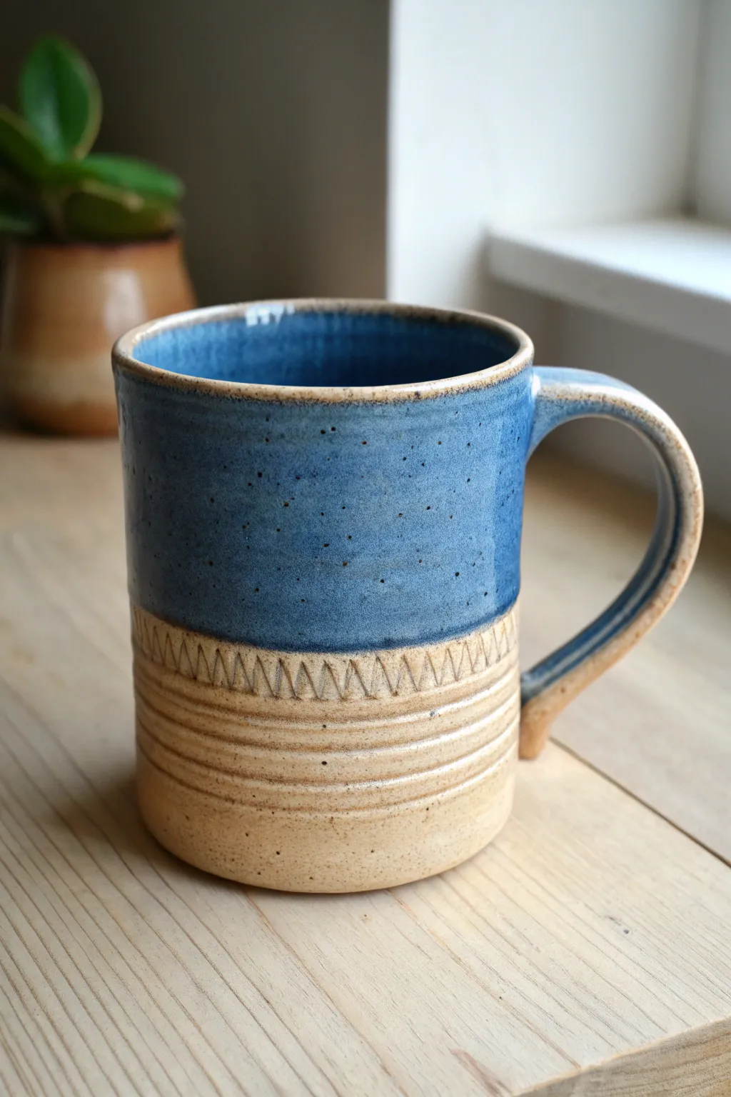 Carved band rim detail adds subtle texture to this bold, minimalist glazed handmade clay mug.