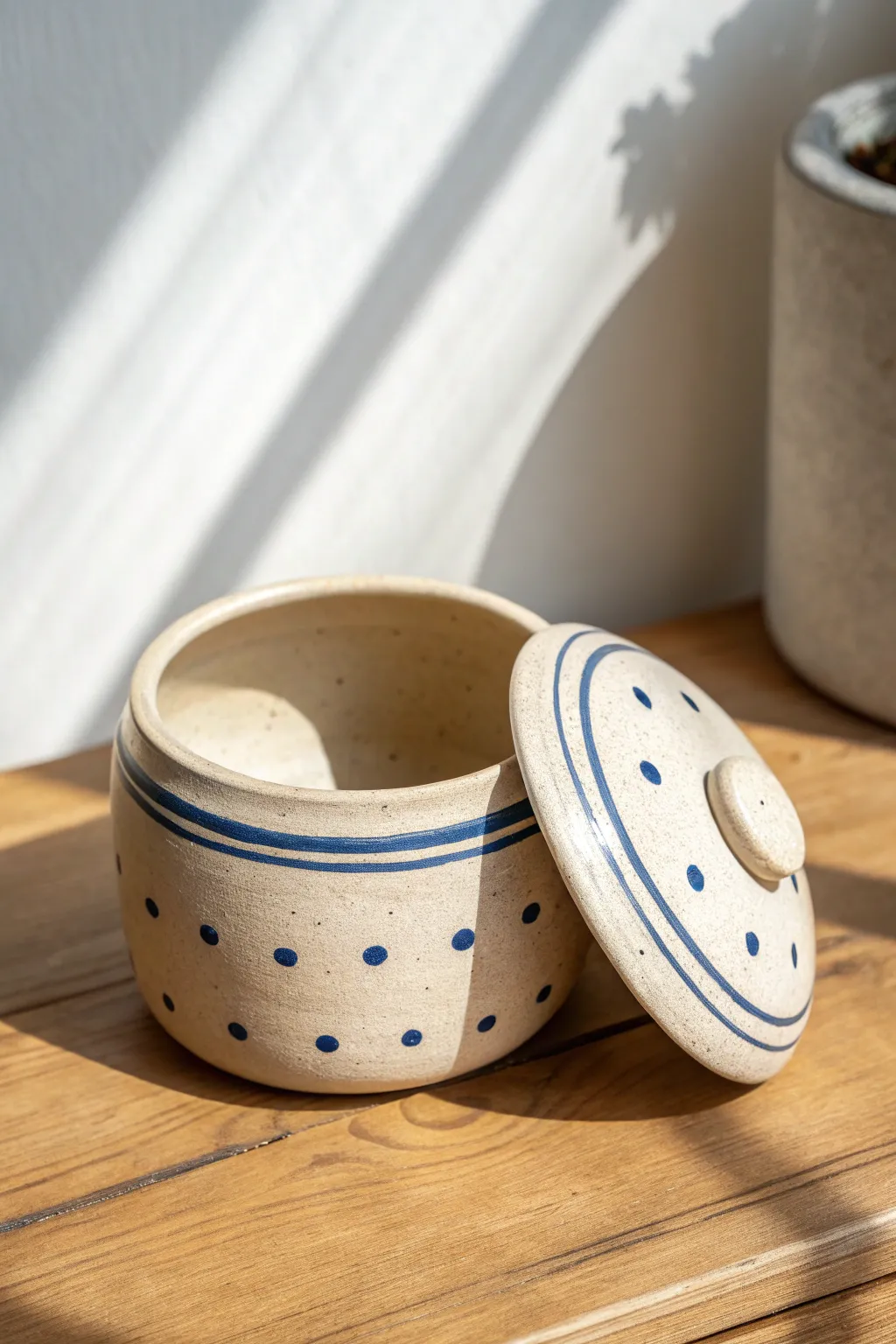 Lidded hollow trinket jar with playful underglaze dots, simple, bold, and beautifully handmade.