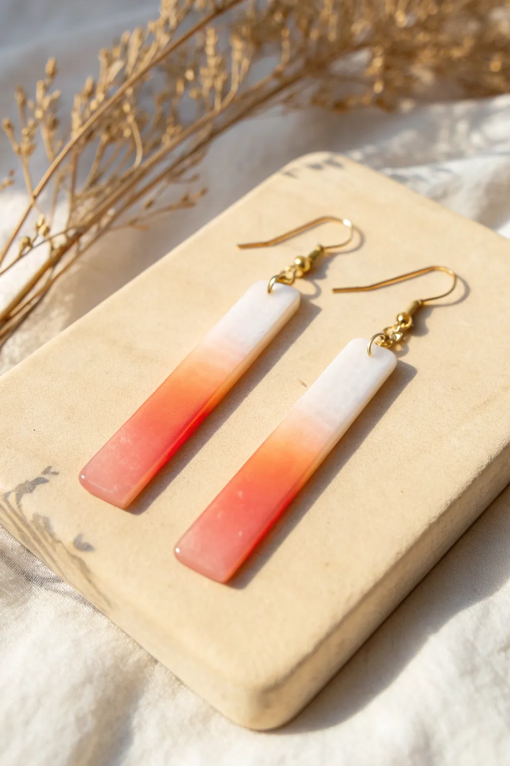Ombre icicle dangle in liquid polymer clay, fading from bold color to glassy clear