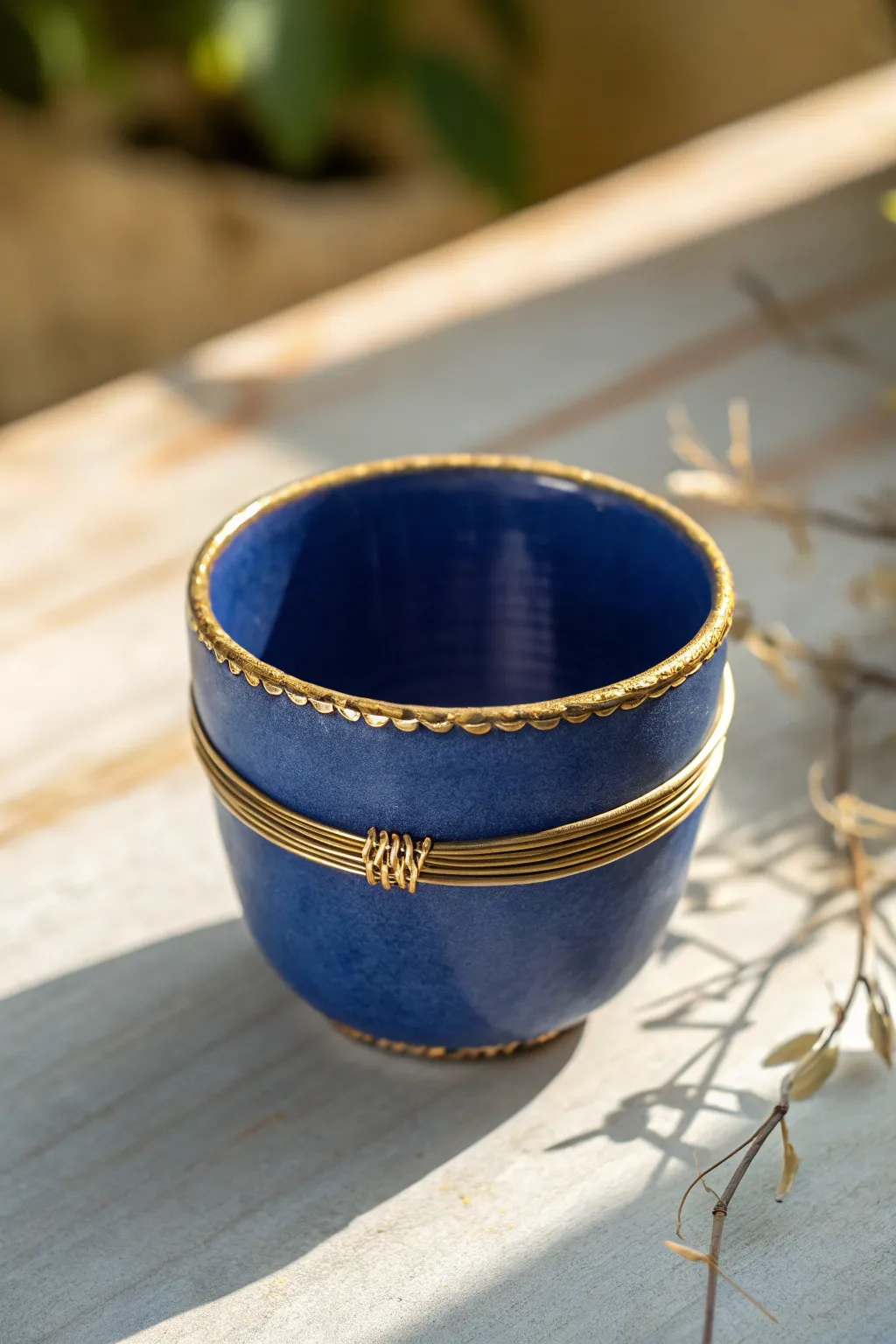 Simple mixed media cup: bold glaze with brass wire rim and foot for modern boho contrast.