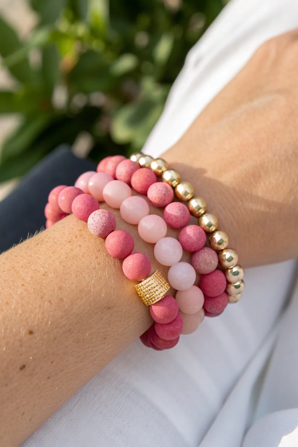 Soft pink stack with tiny gold spacers, minimalist boho bracelet inspo for sunny days.