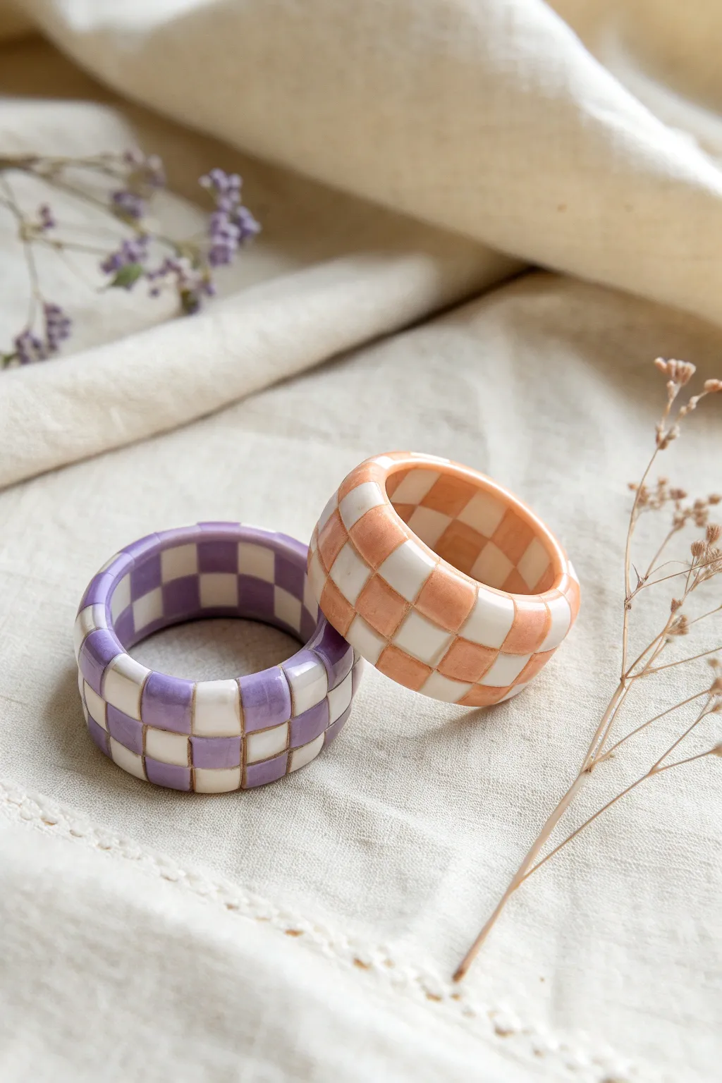 Pastel checkerboard polymer clay rings in lavender and peach for a cozy minimalist look