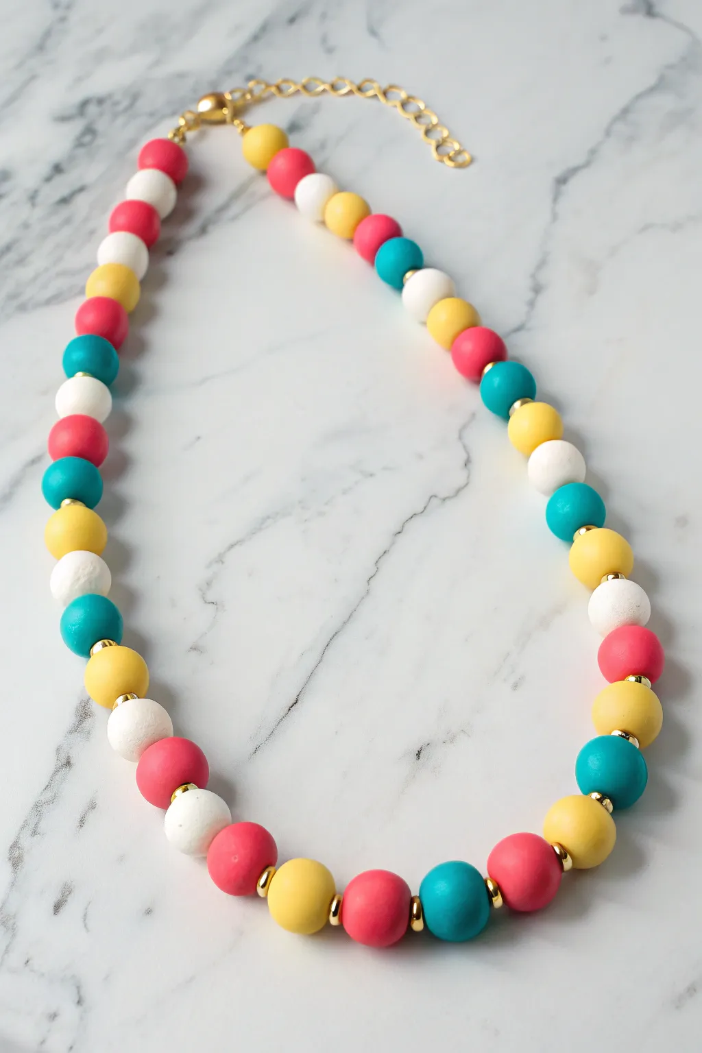 Preppy color blocks meet tiny gold spacers for an easy glam clay bead necklace upgrade.